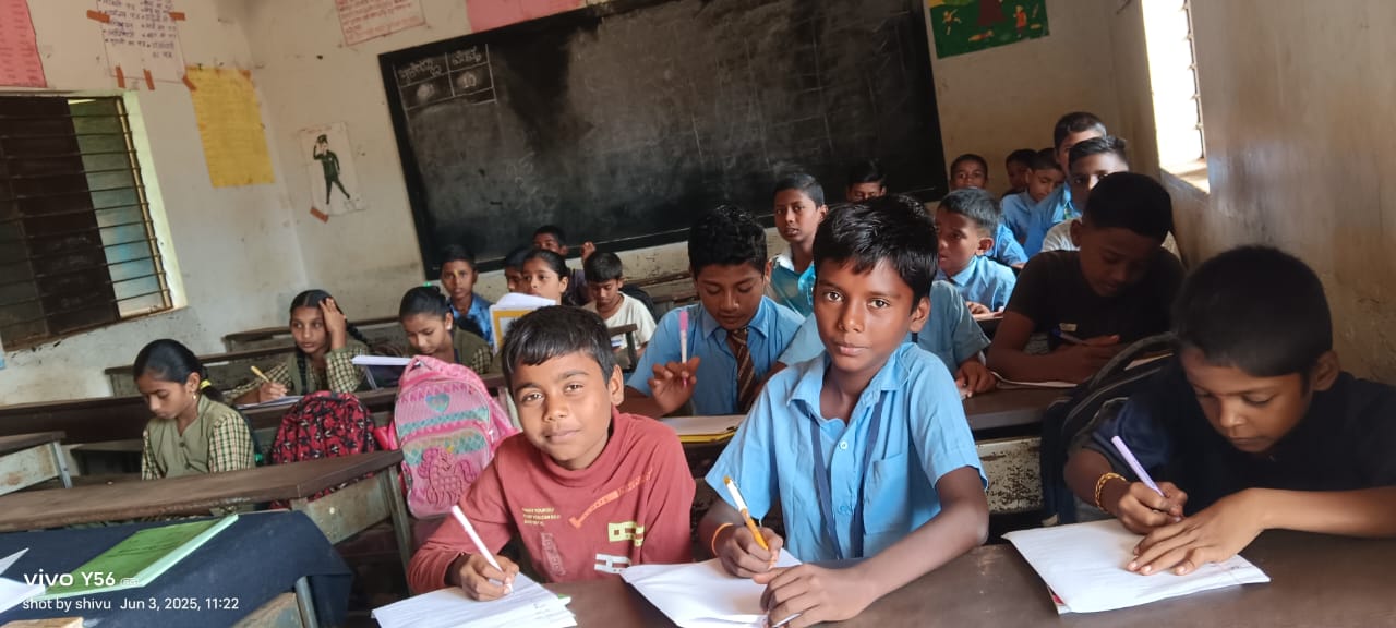 Students in blue uniforms focused on writing and studying at wooden desks